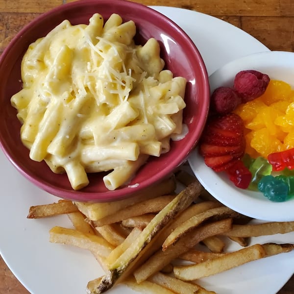 Southern mac and cheese, french fries, and a side of fruit and gummy bears.